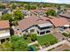 Aerial view of the home featuring a large backyard, covered patio, and lush landscaping at 8621 W Morten Ave, Glendale, AZ 85305