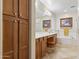 Bright bathroom featuring tile floors, a double vanity, and a large soaking tub at 8621 W Morten Ave, Glendale, AZ 85305