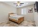 Cozy bedroom featuring tile floors, plantation shutters, ceiling fan and comfortable bed for a relaxing retreat at 8621 W Morten Ave, Glendale, AZ 85305