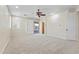 Large bedroom featuring neutral walls, carpet, and slider doors to the back patio at 8621 W Morten Ave, Glendale, AZ 85305
