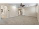 Spacious main bedroom with neutral walls, carpet, and an entrance into the ensuite bathroom at 8621 W Morten Ave, Glendale, AZ 85305