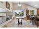 Bright dining area with large windows, plantation shutters, and adjacent kitchen is perfect for meals at 8621 W Morten Ave, Glendale, AZ 85305