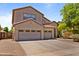 Attractive two-story home boasts a three-car garage and a well-manicured front yard, enhancing its curb appeal at 8621 W Morten Ave, Glendale, AZ 85305