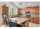 Gourmet kitchen featuring granite countertops, a central island, and stainless steel appliances, perfect for cooking at 8621 W Morten Ave, Glendale, AZ 85305