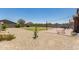 Spacious backyard featuring a lawn, patio, and desert landscaping at 8735 N 185Th Ave, Waddell, AZ 85355
