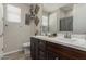 Bathroom vanity with double sinks and dark wood cabinets at 8735 N 185Th Ave, Waddell, AZ 85355