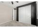 Bedroom with carpet, closet, and black accent wall at 8735 N 185Th Ave, Waddell, AZ 85355
