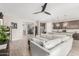Bright, open-concept living area with a view of the kitchen, perfect for entertaining and Gathering gatherings at 8735 N 185Th Ave, Waddell, AZ 85355