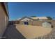 Spacious backyard features gravel landscaping, brick perimeter wall, storage shed, and gated access at 890 N Bogle Ct, Chandler, AZ 85225