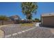 Backyard with large, graveled area, walkway, and well kept block fence at 890 N Bogle Ct, Chandler, AZ 85225