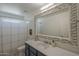 Bathroom vanity featuring a large mirror with decorative tile border at 890 N Bogle Ct, Chandler, AZ 85225