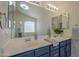 Bathroom featuring double sinks, white countertops, and updated fixtures at 890 N Bogle Ct, Chandler, AZ 85225