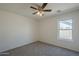 Neutral bedroom with a ceiling fan and natural light from the window at 890 N Bogle Ct, Chandler, AZ 85225