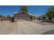 Charming single-story home with well-maintained front yard, two-car garage, and desert landscaping at 890 N Bogle Ct, Chandler, AZ 85225