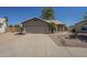 Charming single-story home with well-maintained front yard, two-car garage, and desert landscaping at 890 N Bogle Ct, Chandler, AZ 85225
