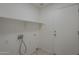 The laundry room has tile floors, a white storage shelf and an exterior door at 890 N Bogle Ct, Chandler, AZ 85225
