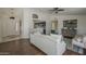 Cozy living space showcasing dark wood floors, stylish furnishings, and an open kitchen view at 890 N Bogle Ct, Chandler, AZ 85225
