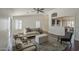 Bright living room featuring stylish furniture, ceiling fan, and an open view to the kitchen at 890 N Bogle Ct, Chandler, AZ 85225