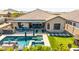 Stunning aerial perspective of home showcasing pool, outdoor kitchen and living spaces at 9029 S 15Th St, Phoenix, AZ 85042