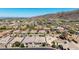 Wide aerial perspective showcasing a residential neighborhood near rolling mountain landscape at 9029 S 15Th St, Phoenix, AZ 85042