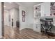 Inviting home office with a built-in workstation, storage cabinets, and wood-look floors at 9029 S 15Th St, Phoenix, AZ 85042