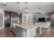 Bright kitchen with an island features granite counters and stainless appliances at 9029 S 15Th St, Phoenix, AZ 85042