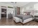 Spacious main bedroom features an elegant light fixture and gray walls at 9029 S 15Th St, Phoenix, AZ 85042