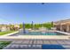 Gorgeous backyard pool with waterfalls and lush landscaping, ideal for relaxation at 9029 S 15Th St, Phoenix, AZ 85042