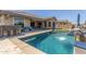 Beautiful backyard pool with a built-in bar, perfect for entertaining guests at 9029 S 15Th St, Phoenix, AZ 85042