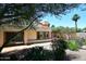 Spacious backyard featuring a covered patio, lush vegetation, and serene views at 9235 N 101St St, Scottsdale, AZ 85258