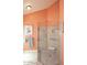Beautiful bathroom featuring a glass-enclosed shower and handrails at 9235 N 101St St, Scottsdale, AZ 85258