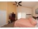 Inviting bedroom featuring a bed, and a ceiling fan at 9235 N 101St St, Scottsdale, AZ 85258