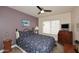 Cozy bedroom with a ceiling fan, comfortable bed, and natural light at 9235 N 101St St, Scottsdale, AZ 85258