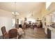 Bright living room features vaulted ceiling, hardwood floors, and stylish decor at 9235 N 101St St, Scottsdale, AZ 85258