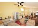 Open-concept living room with wet bar perfect for entertaining guests at 9235 N 101St St, Scottsdale, AZ 85258