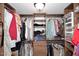 Well-organized walk-in closet with ample hanging and shelving space at 9235 N 101St St, Scottsdale, AZ 85258