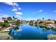 Scenic canal view with waterfront homes and lush greenery in Scottsdale at 9235 N 101St St, Scottsdale, AZ 85258