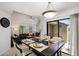 Open dining area with stylish decor, seamlessly connected to the living room and featuring sliding glass door at 10115 E Mountain View Rd # 2061, Scottsdale, AZ 85258