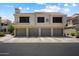 Exterior shot of a multi-unit building with garages, showcasing the architectural design at 10115 E Mountain View Rd # 2061, Scottsdale, AZ 85258