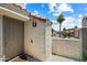 Inviting front entrance with a decorative door, and a cozy terrace with view of a palm tree at 10115 E Mountain View Rd # 2061, Scottsdale, AZ 85258