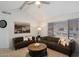 Spacious living room with vaulted ceiling, comfortable seating, ceiling fan, and neutral carpet at 10115 E Mountain View Rd # 2061, Scottsdale, AZ 85258