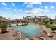 View of a beautiful pond surrounded by landscaping, offering a tranquil view at 10115 E Mountain View Rd # 2061, Scottsdale, AZ 85258