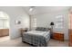 Bright bedroom featuring a comfy bed, carpet, natural light, and an ensuite bathroom at 10235 N 31St St # 2, Phoenix, AZ 85028