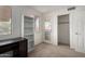 Minimalist bedroom with neutral carpet, exterior door, and closet space at 10235 N 31St St # 2, Phoenix, AZ 85028