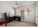 Spacious bedroom with ceiling fan, ample natural light, and workspace at 10235 N 31St St # 2, Phoenix, AZ 85028
