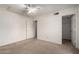 Bright bedroom with neutral walls, carpet, closet and natural light from two windows at 10235 N 31St St # 2, Phoenix, AZ 85028