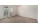 Cozy room with carpet, natural light, and an exterior door with glass panes at 10235 N 31St St # 2, Phoenix, AZ 85028