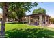 Community pool surrounded by a manicured lawn and a gazebo at 10235 N 31St St # 2, Phoenix, AZ 85028