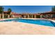 Community pool with lounge chairs and a barbecue at 10235 N 31St St # 2, Phoenix, AZ 85028