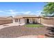 Backyard with gravel, artificial turf, covered patio, and seating area at 10617 W Ross Ave, Peoria, AZ 85382